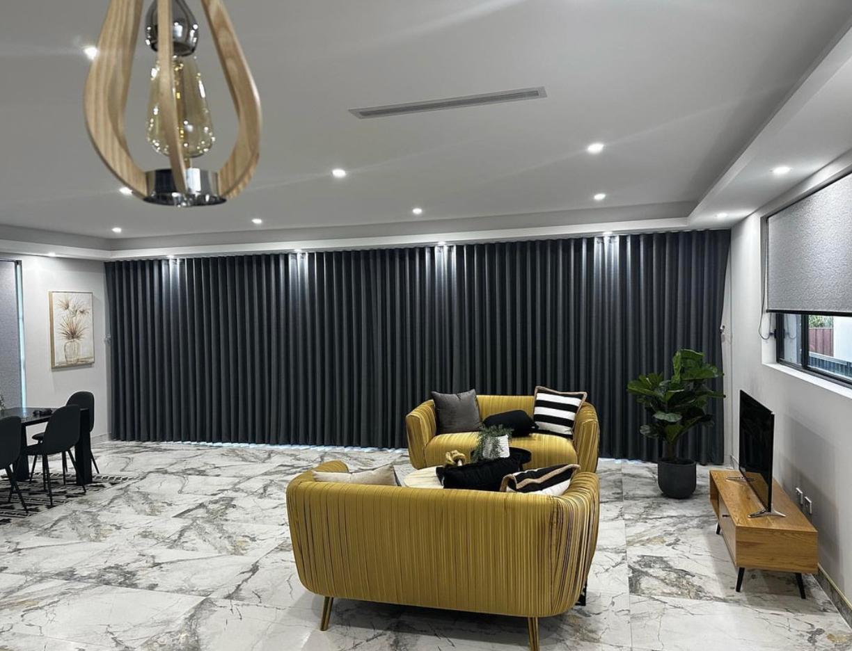 Premium custom blockout roller blinds installed perfectly in a modern Sydney home