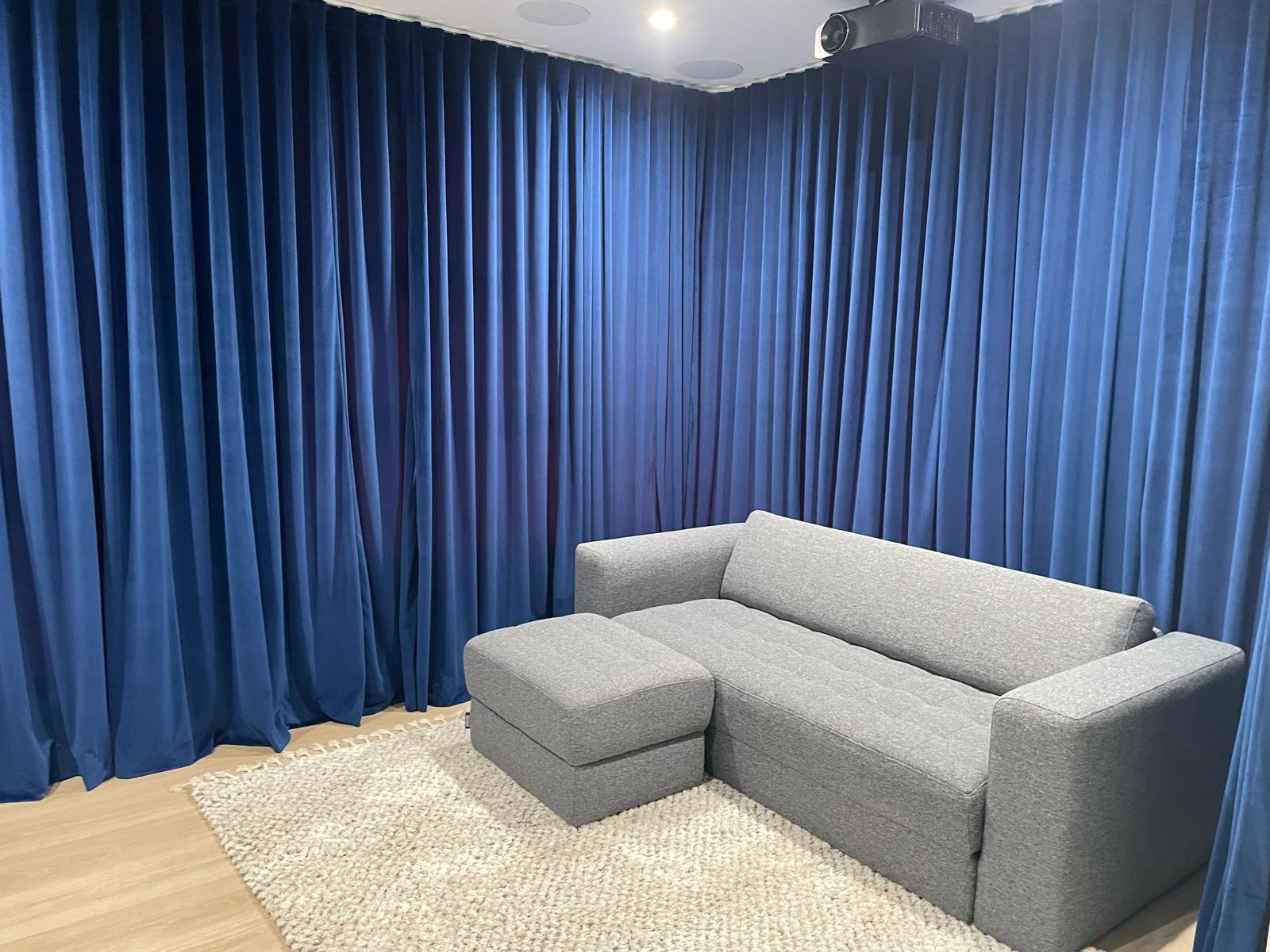 Custom blockout roller blinds installed in a bright modern home office